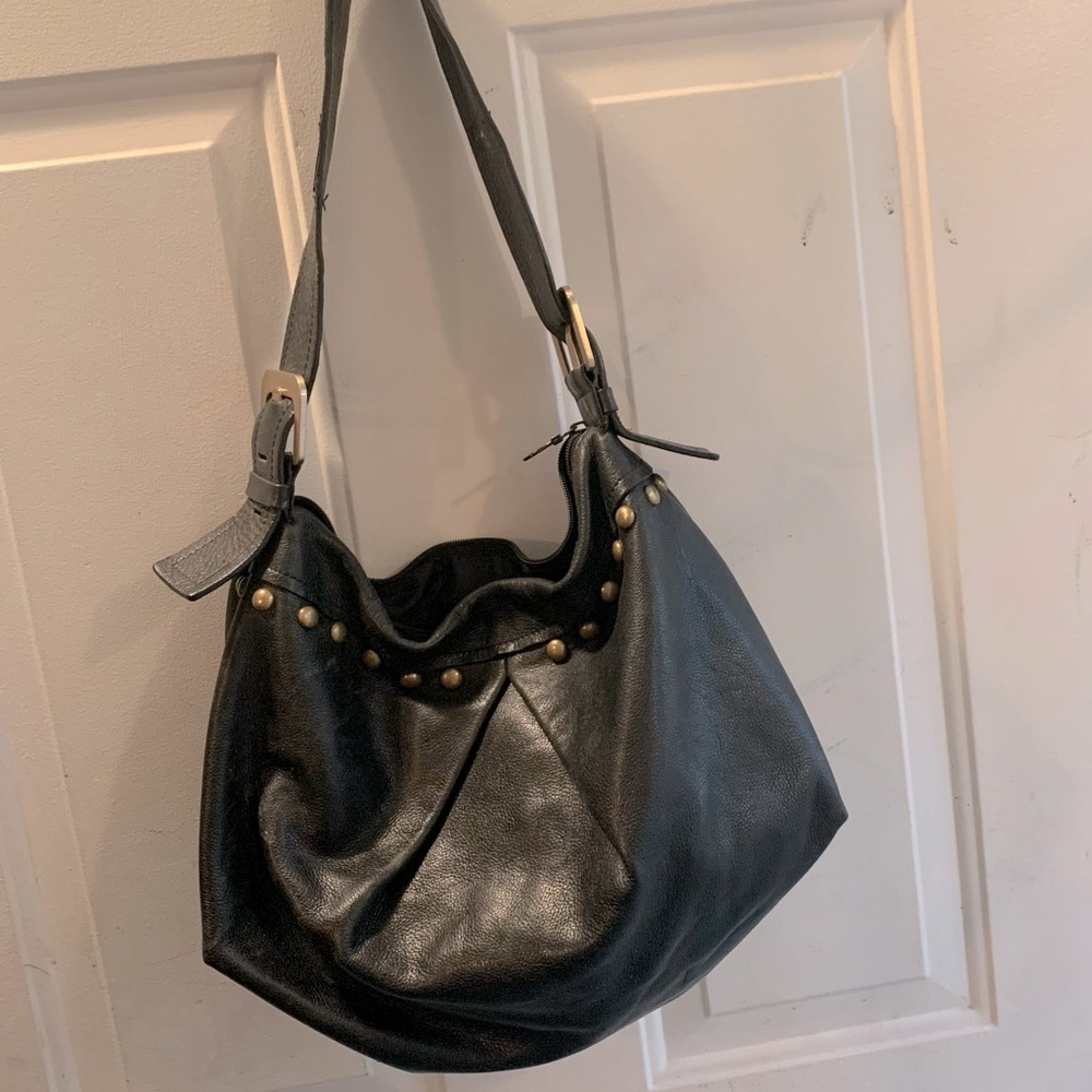 Black shoulder bag with brass details
